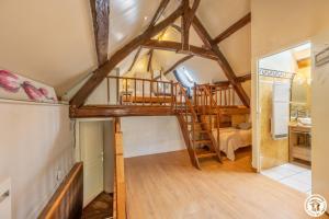 A bed or beds in a room at Gite des groux
