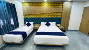 Postel nebo postele na pokoji v ubytování Hotel BKC Gold View
