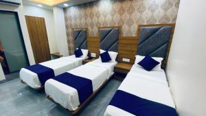 Postel nebo postele na pokoji v ubytování Hotel BKC Gold View