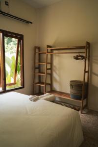 Ένα ή περισσότερα κρεβάτια σε δωμάτιο στο Java Villa Lombok