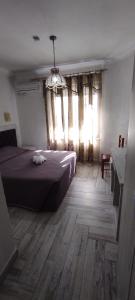 Postel nebo postele na pokoji v ubytování Hotel Livia