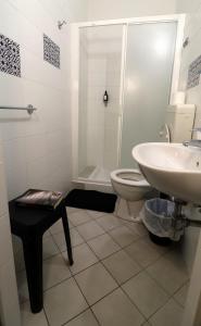a bathroom with a toilet and a sink at Fasthotel in Cervia +39 photos