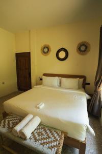 Ένα ή περισσότερα κρεβάτια σε δωμάτιο στο Java Villa Lombok