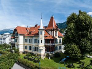 a large house with a red roof at Villa Streintz in Millstatt