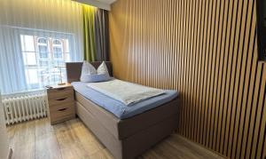 Postel nebo postele na pokoji v ubytování Hotel Stadt Soest