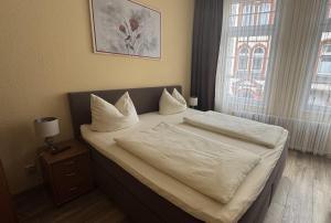 Postel nebo postele na pokoji v ubytování Hotel Stadt Soest