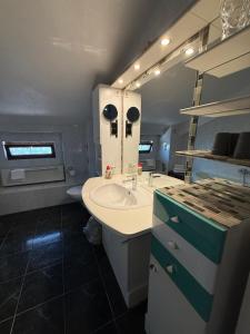 a bathroom with a sink and a toilet in it at Pension am Tiefen See in Potsdam +76 photos