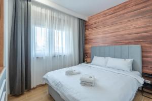 Giường trong phòng chung tại The Forest Club Spa & Apartments +30 ảnh