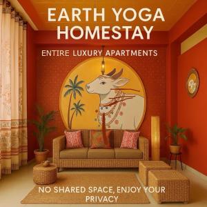a living room with a couch and a sign that reads earth yoga homiversary at Earth Yoga Luxury Apartments in North Lakhimpur +13 photos