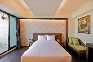 Postel nebo postele na pokoji v ubytování 嬉安平 Si Anping by Hotel Si