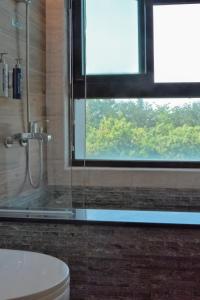 Koupelna v ubytování 嬉安平 Si Anping by Hotel Si