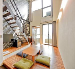 Postel nebo postele na pokoji v ubytování 嬉安平 Si Anping by Hotel Si