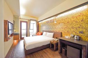 Postel nebo postele na pokoji v ubytování 嬉安平 Si Anping by Hotel Si