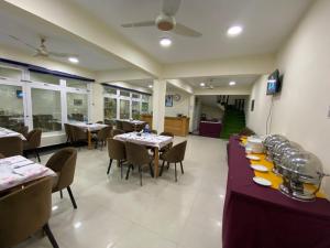 a dining room with tables and chairs in a restaurant at River View Hotel Shigar in Shigar