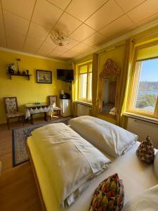 a bedroom with a large bed in a room at Pension am Tiefen See in Potsdam