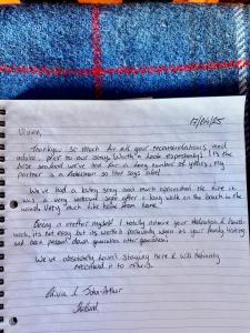 a notebook with handwriting on it next to a flag at Eco Crofter's Wagon by the Sea - Off Grid Experience - No electricity - As seen soon on Netflix in Oldshoremore
