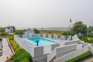 an overhead view of a swimming pool at a resort at Tranquil 2-Bedroom Condo in Hidden Bay Relax & Enjoy Bay Views in Ocean City