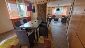 a dining room with a table and chairs at Ferienwohnung Wiesental 89331 Burgau, Wiesentalstrasse 1 in Burgau