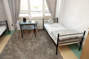 Postel nebo postele na pokoji v ubytování Alliance Hostel