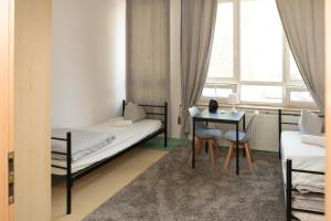 Postel nebo postele na pokoji v ubytování Alliance Hostel