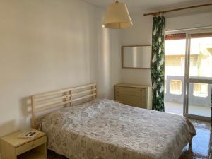Postel nebo postele na pokoji v ubytování Appartamento Stefania 10