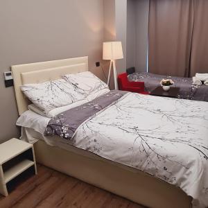 Postel nebo postele na pokoji v ubytování Driti Hotel & Apartments
