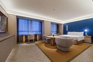 Ένα ή περισσότερα κρεβάτια σε δωμάτιο στο Crystal Orange Shanghai Lujiazui Financial Center Hotel