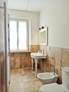 a bathroom with a sink and a toilet at Colleoni 19 in Civitanova Marche +32 photos