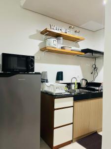Kuchyň nebo kuchyňský kout v ubytování Julianna Staycation Iloilo Condo SMDC