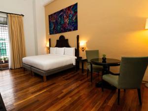 Llit o llits en una habitació de Novotel Cusco