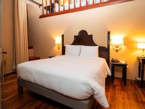 Llit o llits en una habitació de Novotel Cusco
