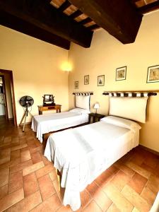 a bedroom with two beds in a room at Tenuta La Casetta in Casciana Terme +29 photos