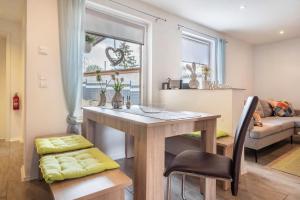 a kitchen and living room with a table and a couch at Ferienhaus Hedrich in Gülzow
