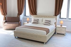 A bed or beds in a room at Brilliant Camere