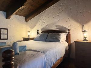 a bedroom with a bed with a wall covered in butterflies at Alojamento Casas da Serra in Porto Santo +47 photos