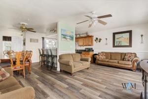 a living room with a couch and a table at Charming 3-Bedroom, 2-Bathroom Townhouse Perfectly Located Near the Boardwalk in Ocean City