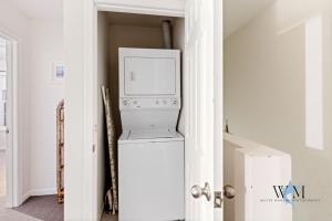 a microwave sitting on top of a refrigerator in a room at Charming 3-Bedroom, 2-Bathroom Townhouse Perfectly Located Near the Boardwalk in Ocean City