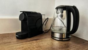 a blender sitting on a counter next to a toaster at Pieter Stuyvesantkerk Peperga-Friesland in Peperga