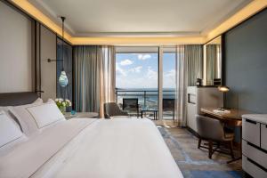 Postel nebo postele na pokoji v ubytování The Vista At Hilton Tel Aviv