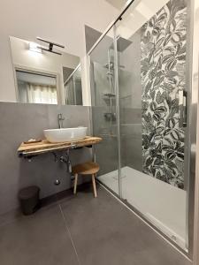 a bathroom with a sink and a shower at Rooms primo piano in Modena +45 photos