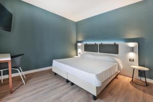 Elba Vibe Smart Hotel客房内的一张或多张床位