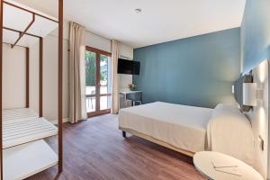 Elba Vibe Smart Hotel客房内的一张或多张床位
