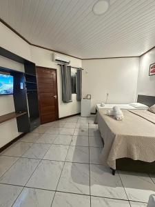 TV a/nebo společenská místnost v ubytování Pousada Alter Villa Suítes