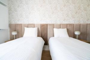 Posteľ alebo postele v izbe v ubytovaní Aparthotel Weissa 7