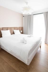 Posteľ alebo postele v izbe v ubytovaní Aparthotel Weissa 7