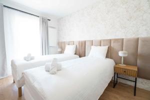 Posteľ alebo postele v izbe v ubytovaní Aparthotel Weissa 7