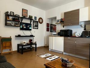 a living room with a kitchen and a table at lavista cozy chalet one bedroom in Ain Sokhna
