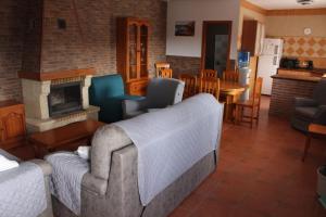 a living room with two couches and a fireplace at Matilde&Leire in Barbate