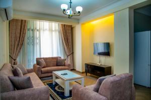 TV a/nebo společenská místnost v ubytování Spring Apartments & Suites