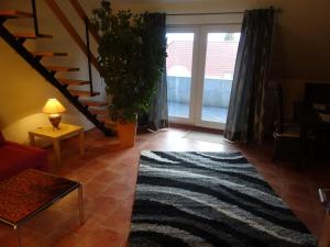 Posezení v ubytování Ferienwohnung Hamburg - Stapelfeld